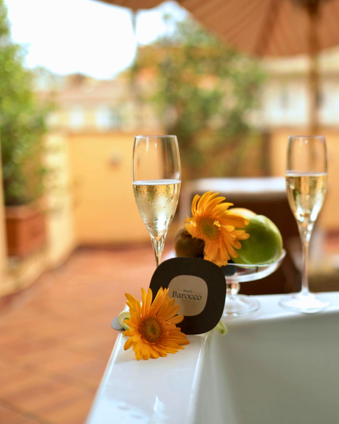 A suite, in the right palazzo, stops being a room.
Ours has a terrace above the rooftops of Rome. A 