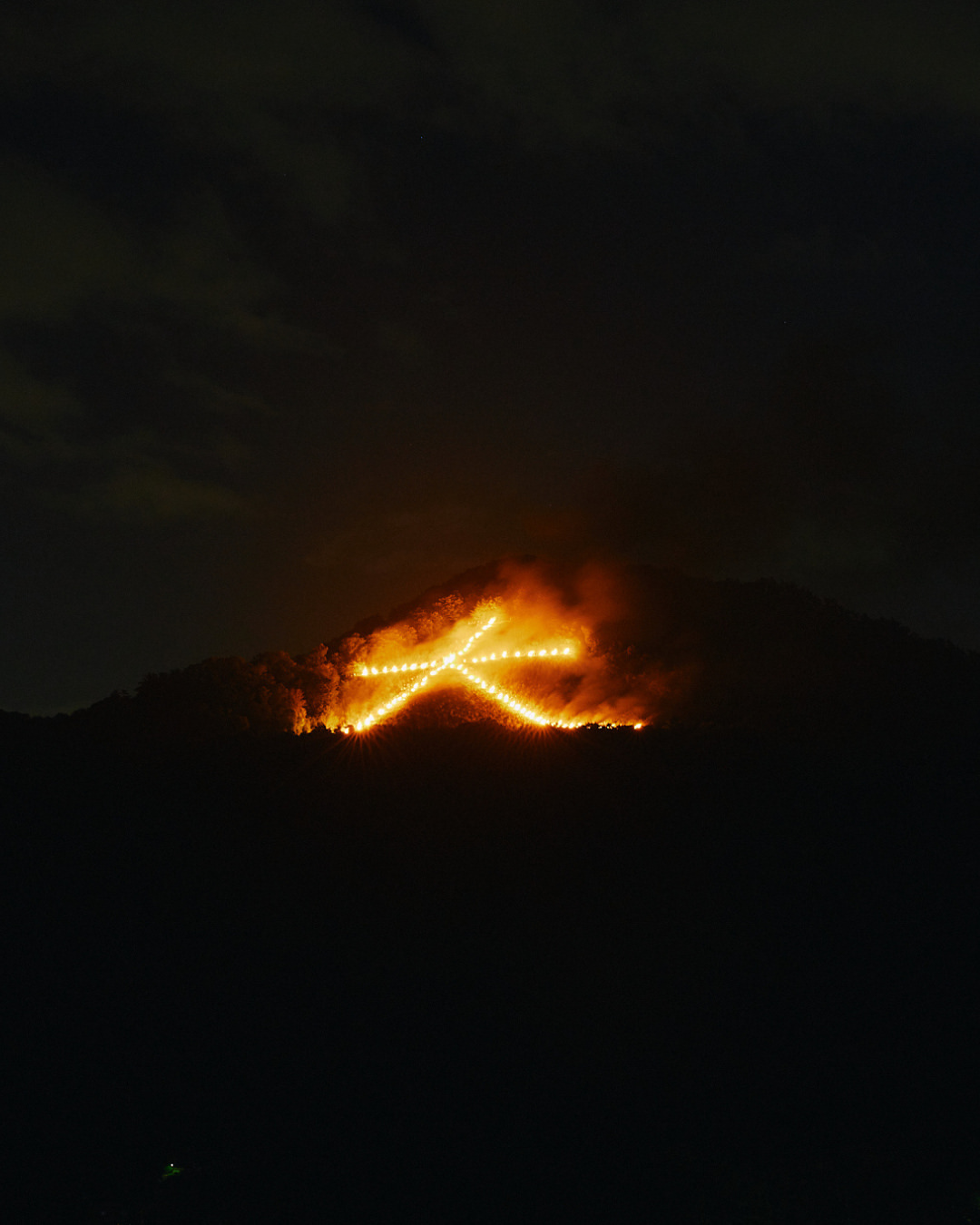 One summer night, five fires illuminate the mountains surrounding Kyoto. Passed down through generat