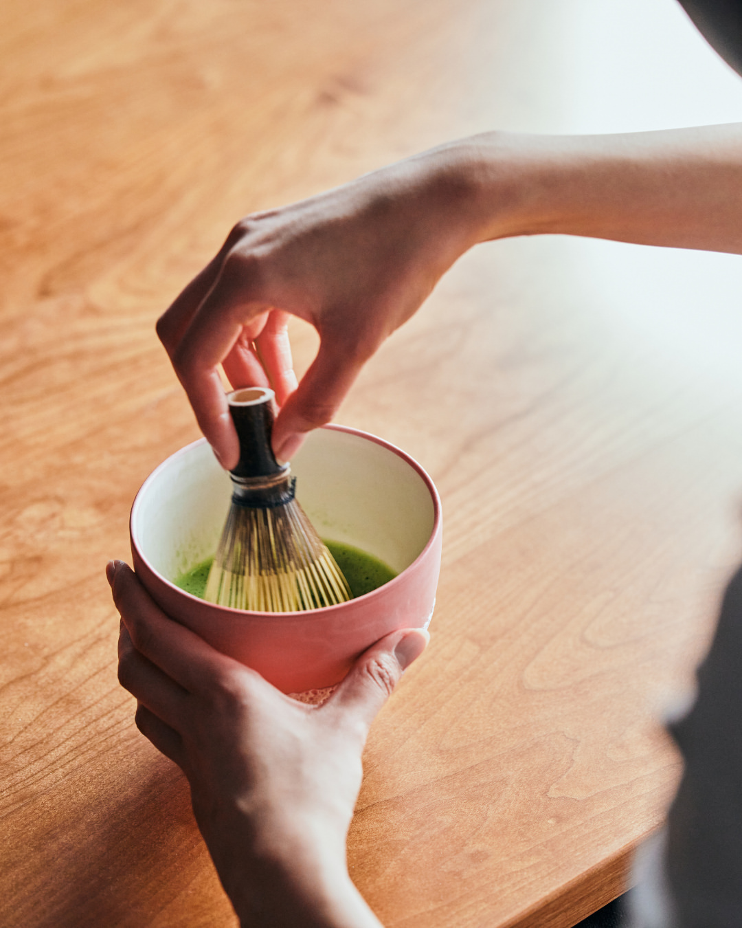 Whisking the matcha and preparing a bowl of tea. Each movement reflects the traditions and sense of 