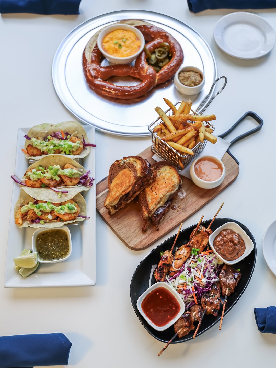 From Gulf Coast shrimp tacos and crispy truffle fries to our Corner patty melt, jumbo Bavarian pretz