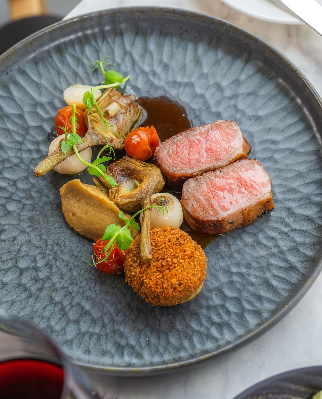 Why choose between tender and crispy when you can have both? ⚖️⁠
⁠
Showcasing lamb two ways: a succu