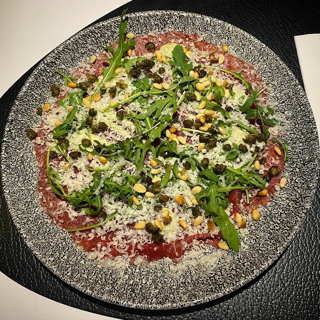 Carpaccio, crispy capers, pesto, Parmezaanse cheese, pine nuts and rocket salad @parkinnamsterdamwes