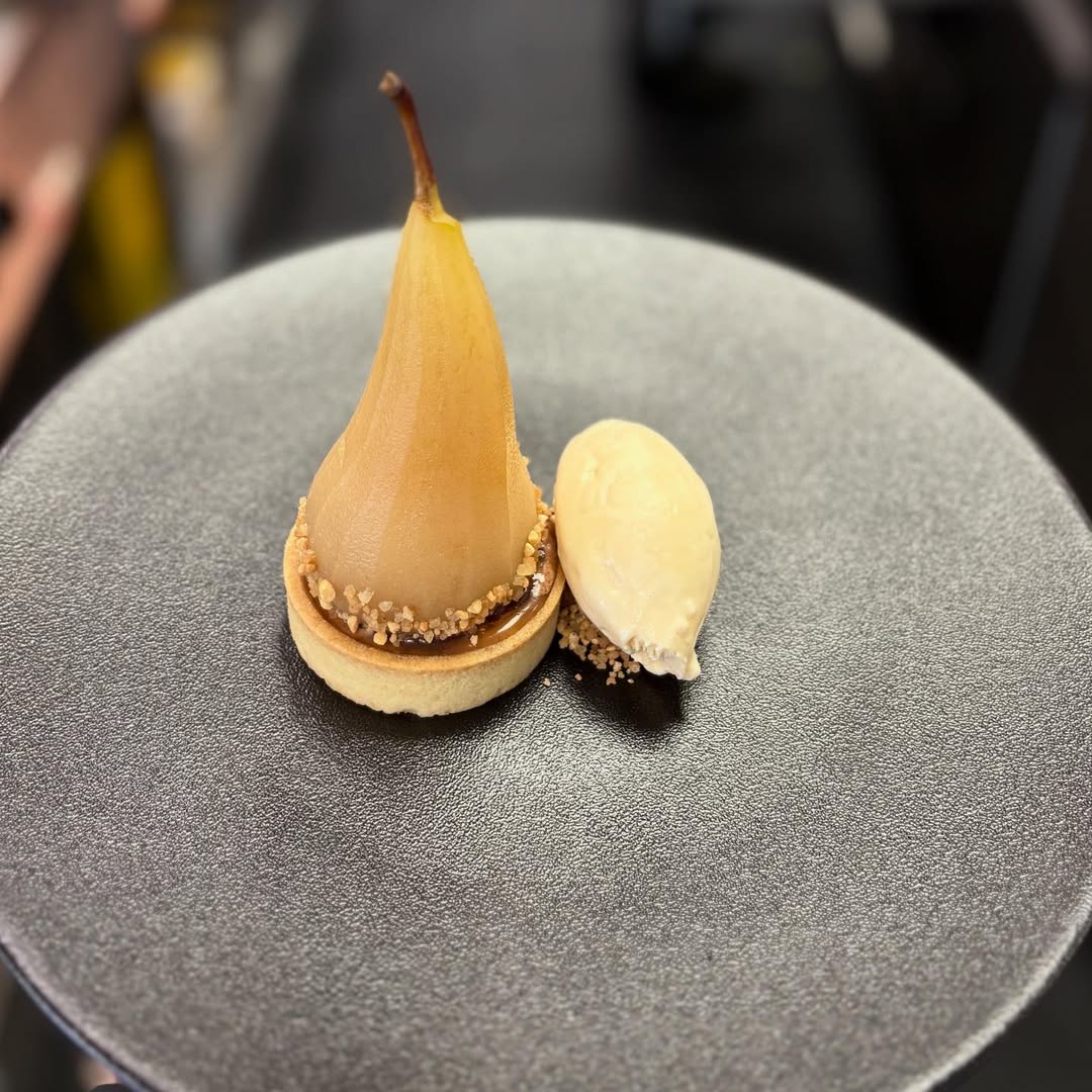 Poached pear in white wine and vanilla, chocolate mousse, chocolate caramel with walnuts and homemad